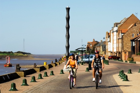 Cycling along the waterfront at Kings Lynn, Norfolk 